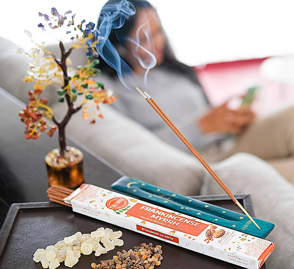 Trumiri resinous incense sticks with incense smoke near a labeled incense box