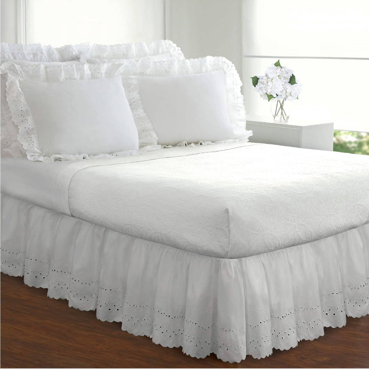 White ruffled eyelet bed skirt with gathered ruffles and perforated eyelet trim