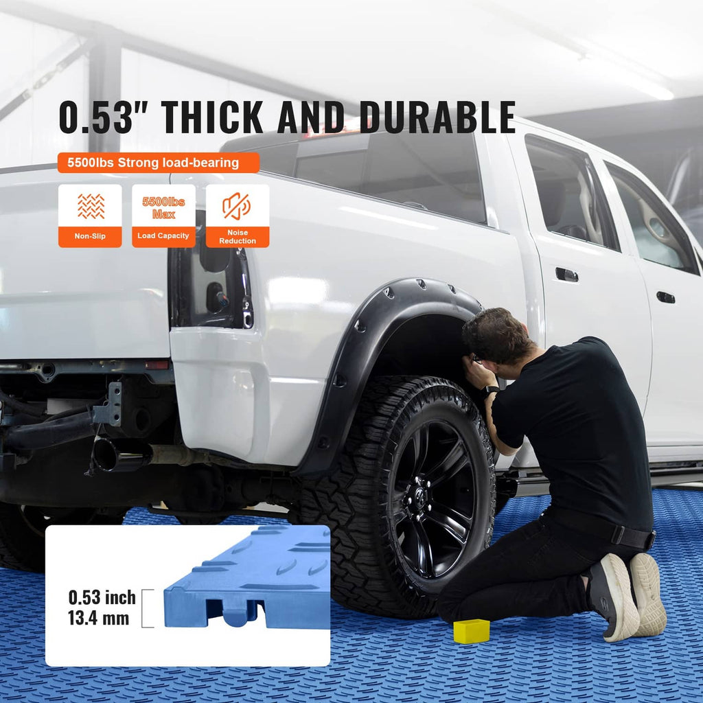 Blue interlocking garage floor tiles supporting a car tire, thick durable surface
