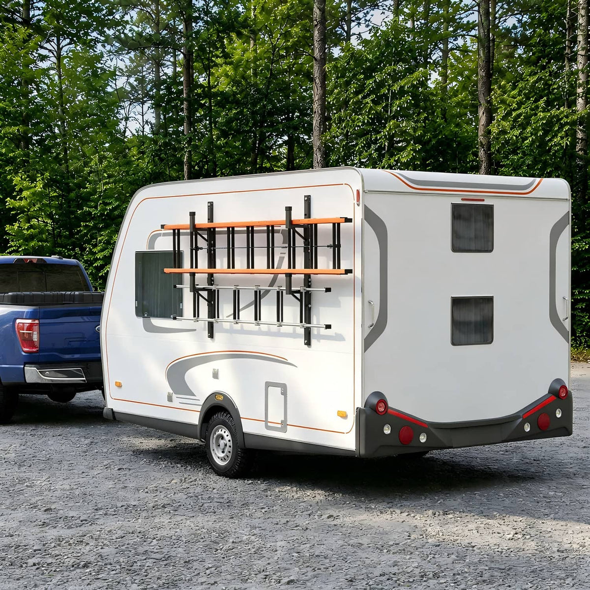 Wall-mounted side ladder rack on enclosed cargo trailer with orange support rails