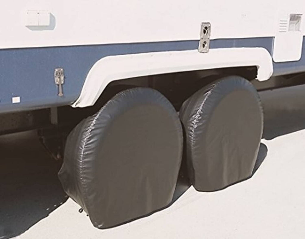 Pair of black tire guard wheel covers mounted on a vehicle