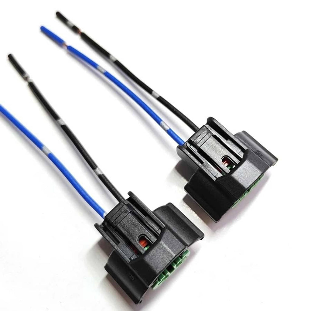 Pair of headlight bulb adapter plugs with green terminals, black housing, blue/black wires