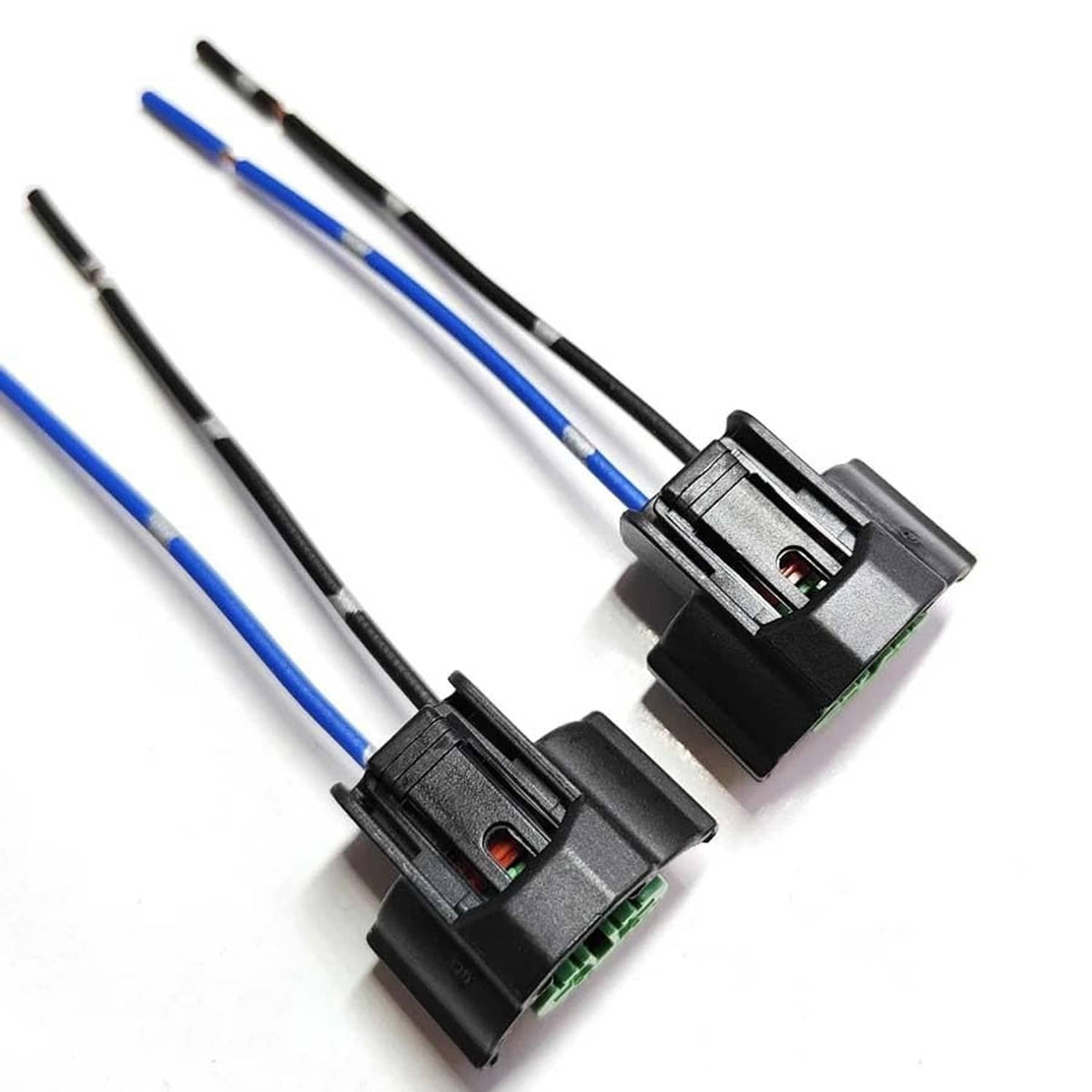 Pair of headlight bulb adapter plugs with green terminals, black housing, blue/black wires