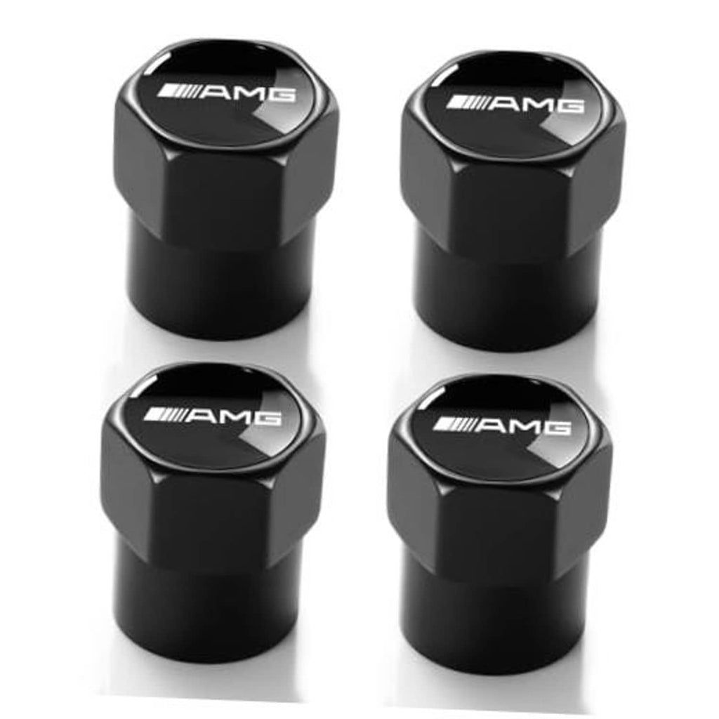 Set of four black metal tire valve caps with AMG logo, hex grip tops