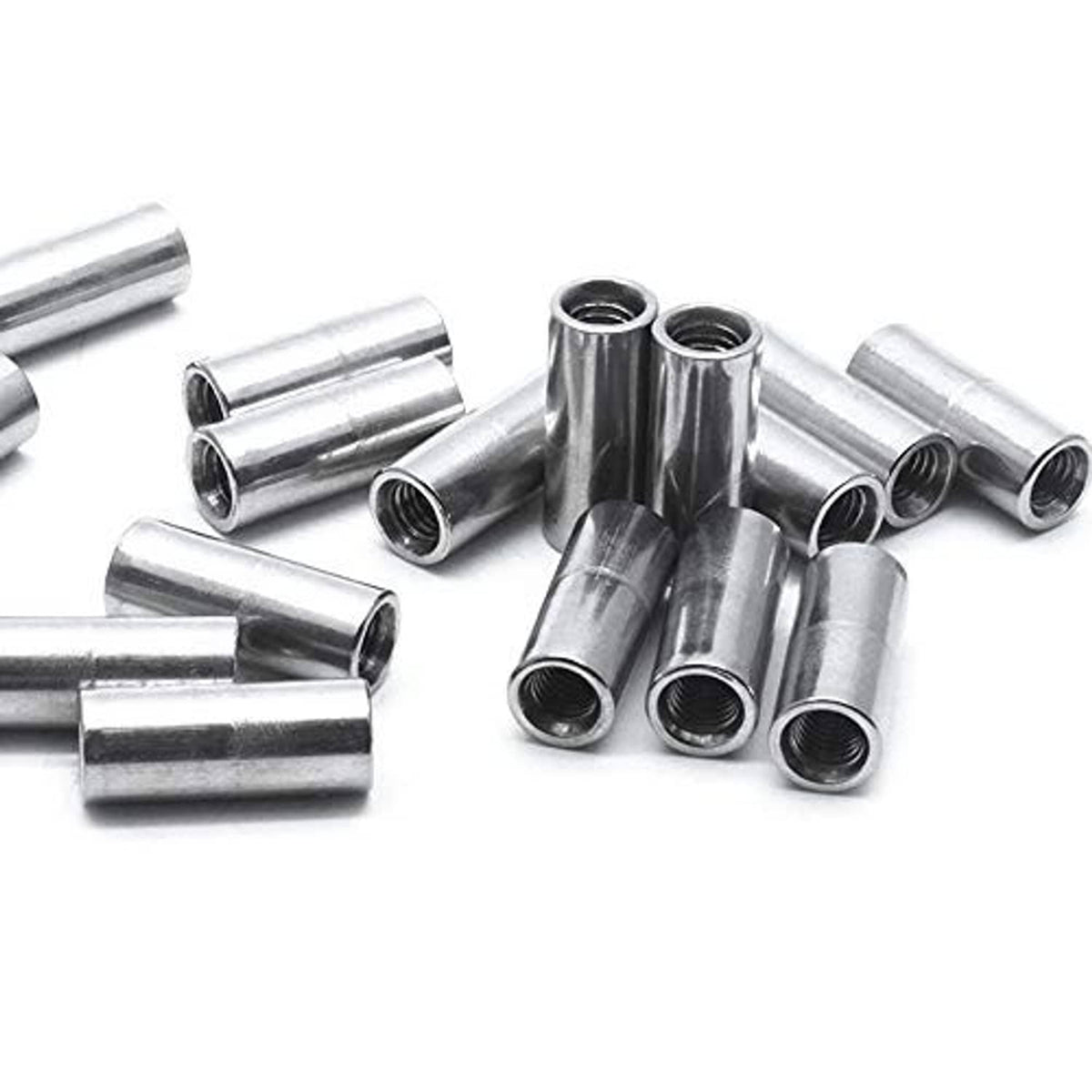 Cluster of round coupling nuts with cylindrical bodies and visible threaded openings
