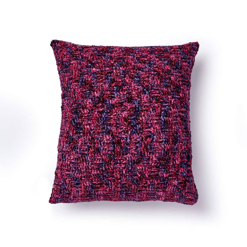 Square textured pillow cover in deep berry red with speckled multicolor yarn.
