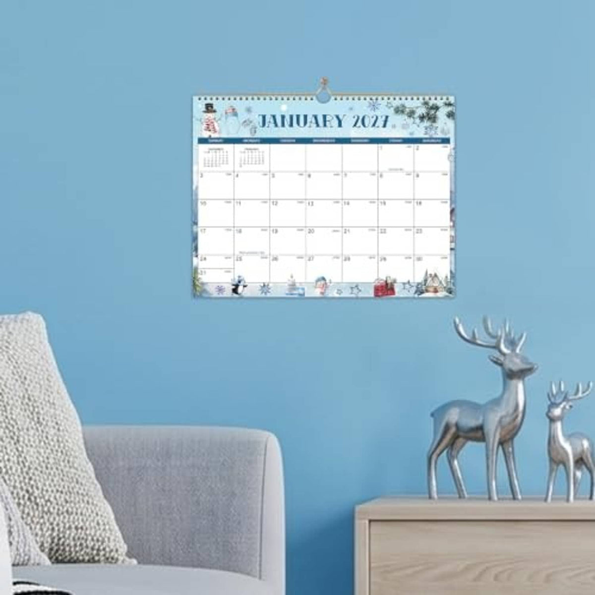 Small blue January 2027 wall calendar with hanging loop and spiral binding