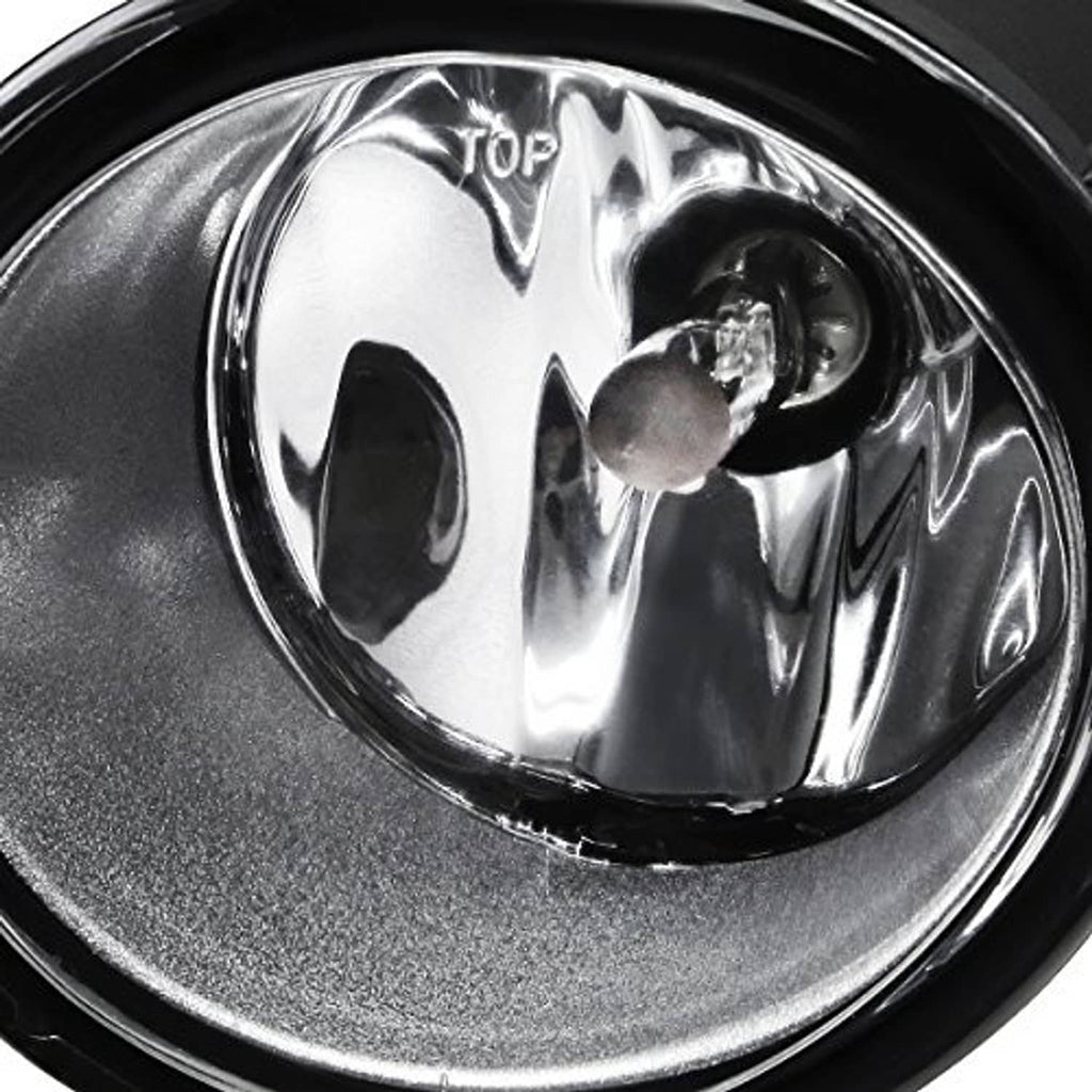 Clear-lens front fog light close-up with chrome reflector and black outer ring