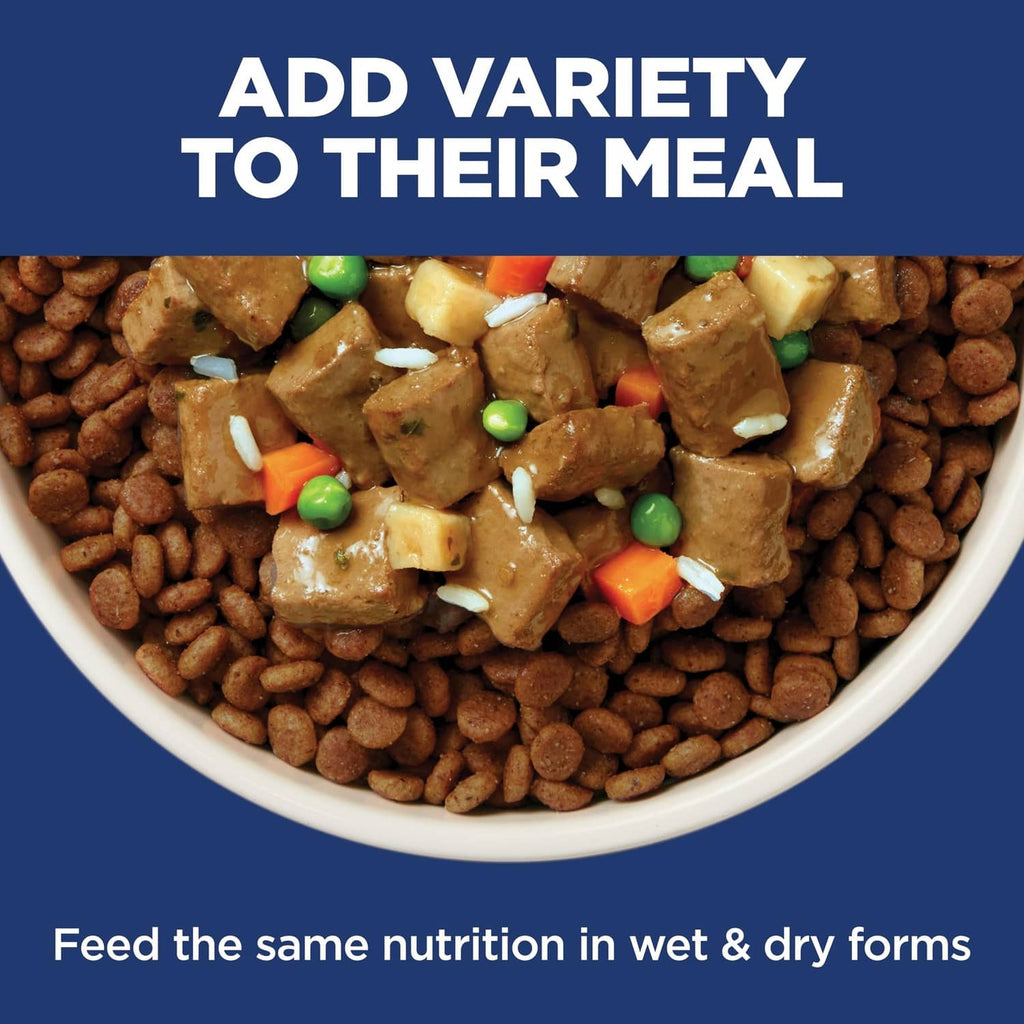 Bowl of dog food kibble with mixed ingredients and add variety to their meal text