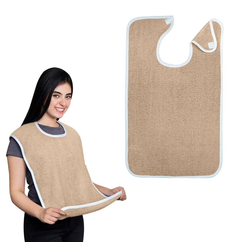 Beige terrycloth adult bib towel with white trim and curved neck opening for full coverage.