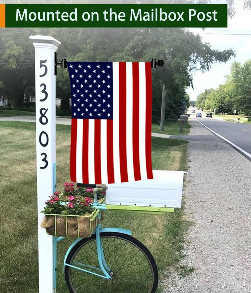 Black metal mailbox post flag holder stand with push-button clips holding a flag