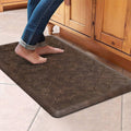 Brown cushioned kitchen floor mat with embossed clover pattern and beveled edges