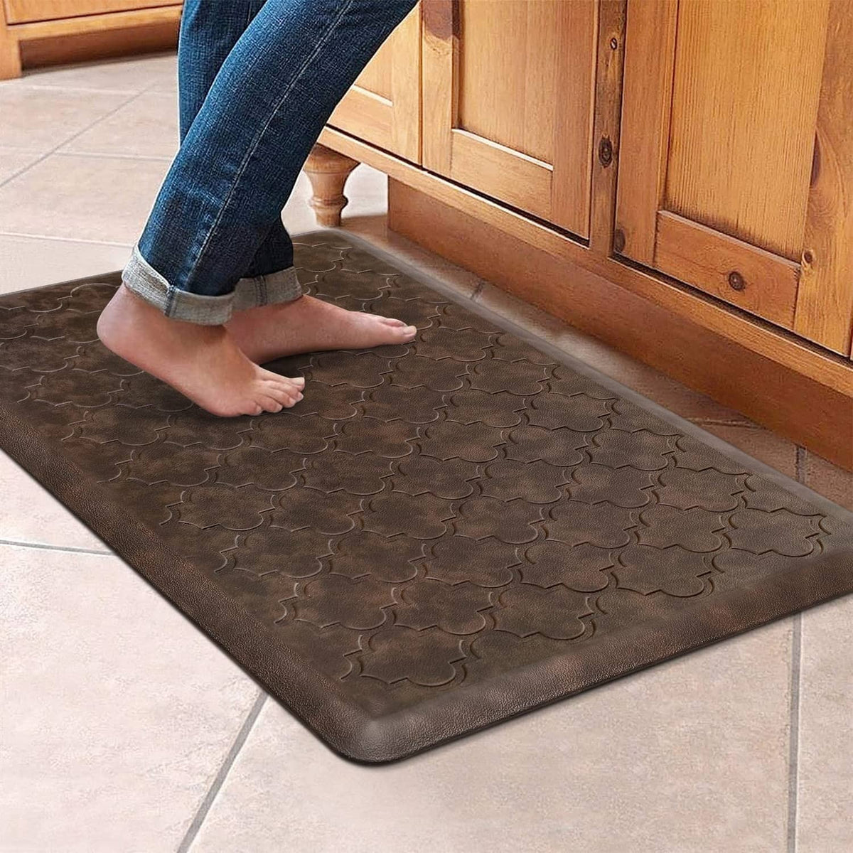 Brown cushioned kitchen floor mat with embossed clover pattern and beveled edges
