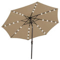 Beige patio umbrella with LED string lights across canopy and black pole