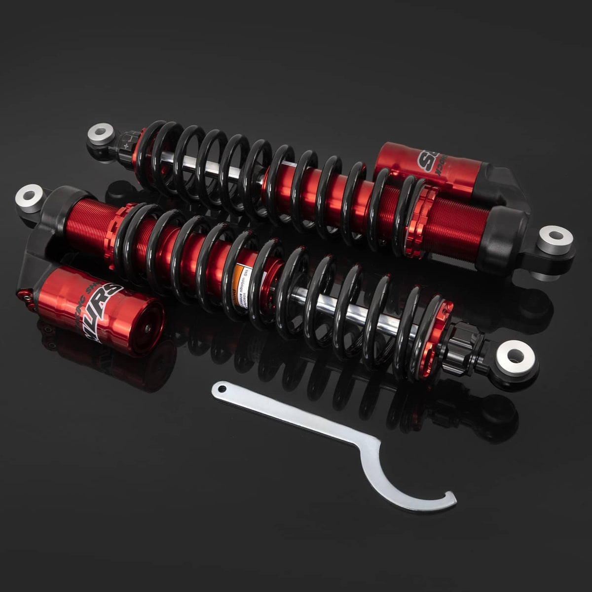 Red adjustable rear air shocks with black coil springs, rear eyelet mounts, and included wrench