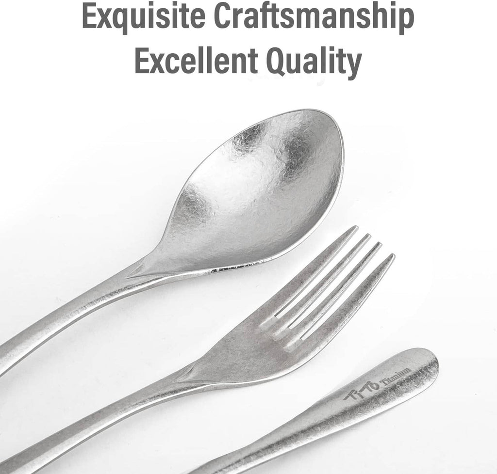 Silver titanium spoon and fork, close-up of smooth handle and 4 tines