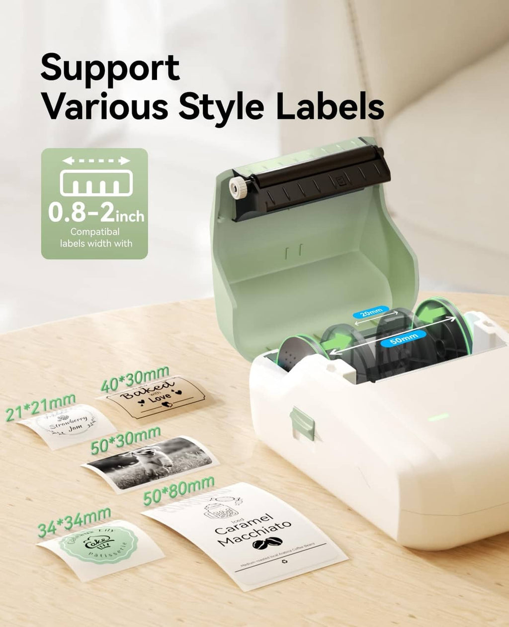 Open green label maker with tape compartment and multiple printed label sheets