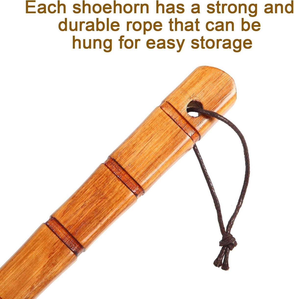 Wooden shoe horn with rope loop and small attachment hole near the curved paddle