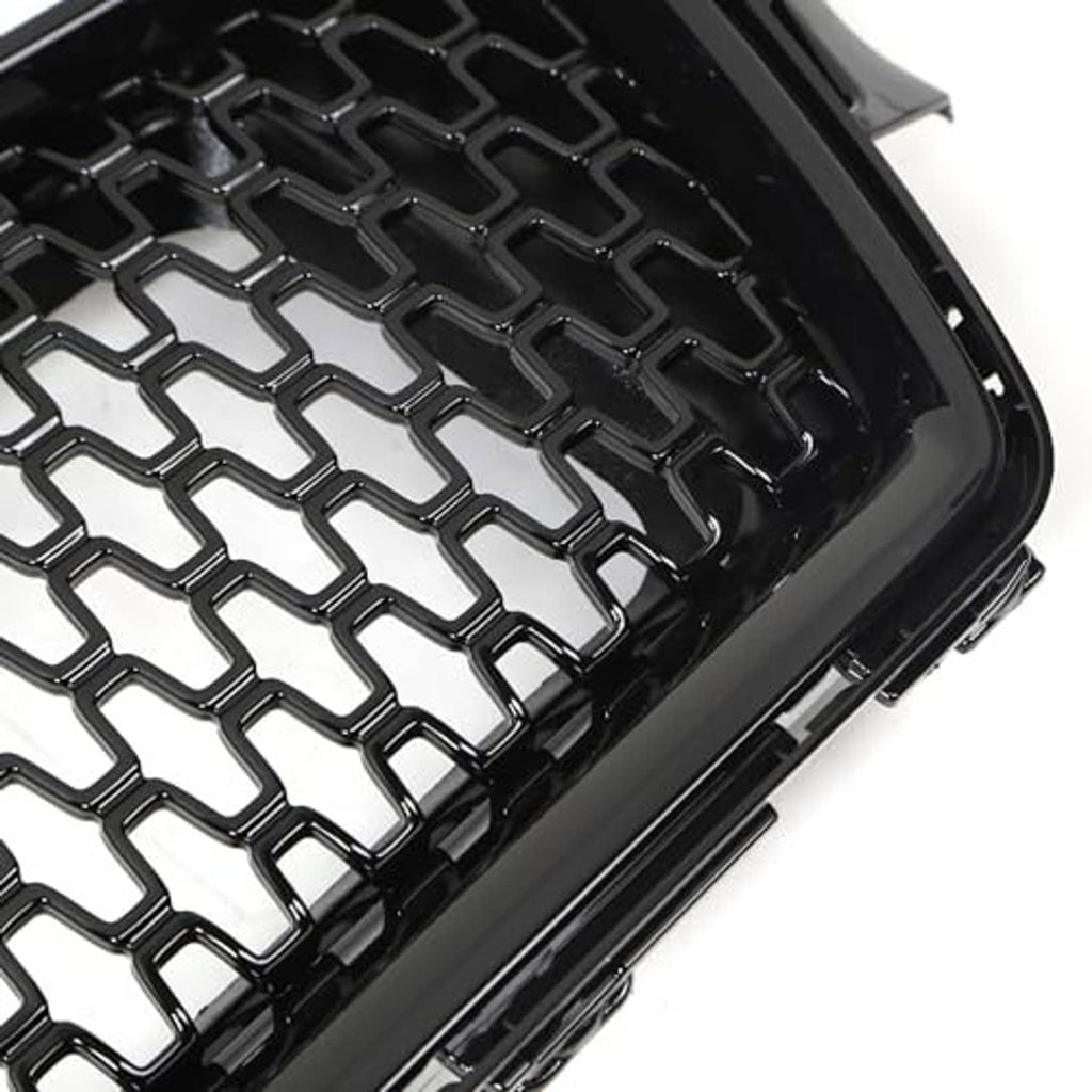 Close-up of black honeycomb mesh grille insert with diamond pattern