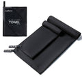 Black microfiber towel folded with carrying pouch and attached hanging loop