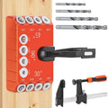 Orange aluminum drill guide jig with multiple angle guides and round hole templates