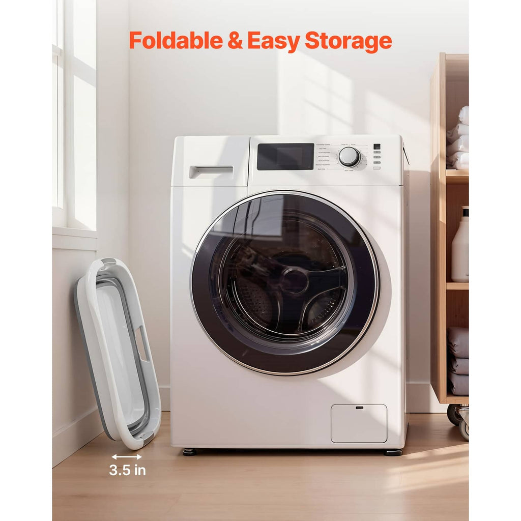 Gray and white collapsible pet bath tub stored upright beside a washing machine
