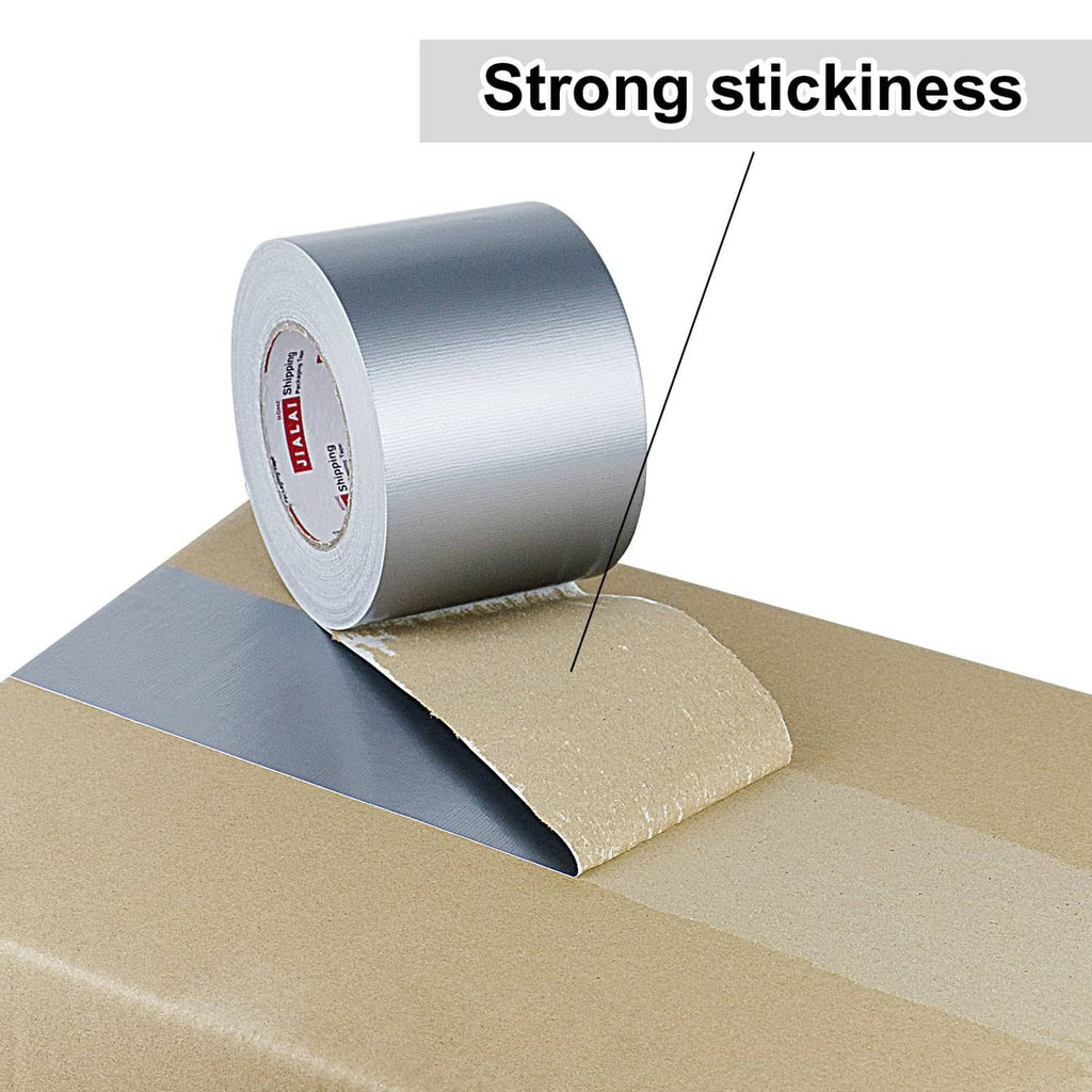 Silver duct tape roll sealing a cardboard box seam, strong adhesive tape.