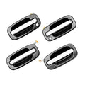 Set of exterior door handle levers with chrome insert and dark housing, four pieces shown