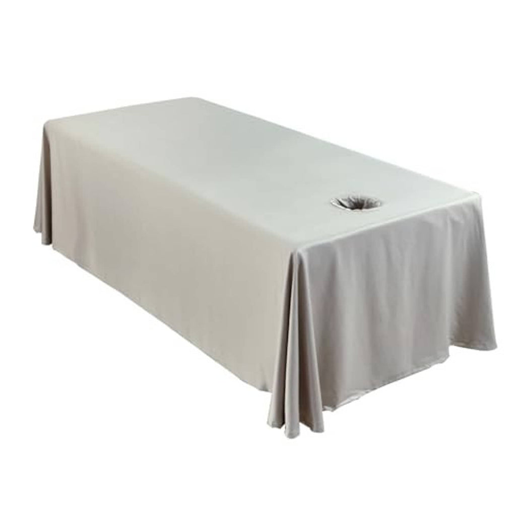 Grey massage table skirt sheet with round face opening, fully draped over sides