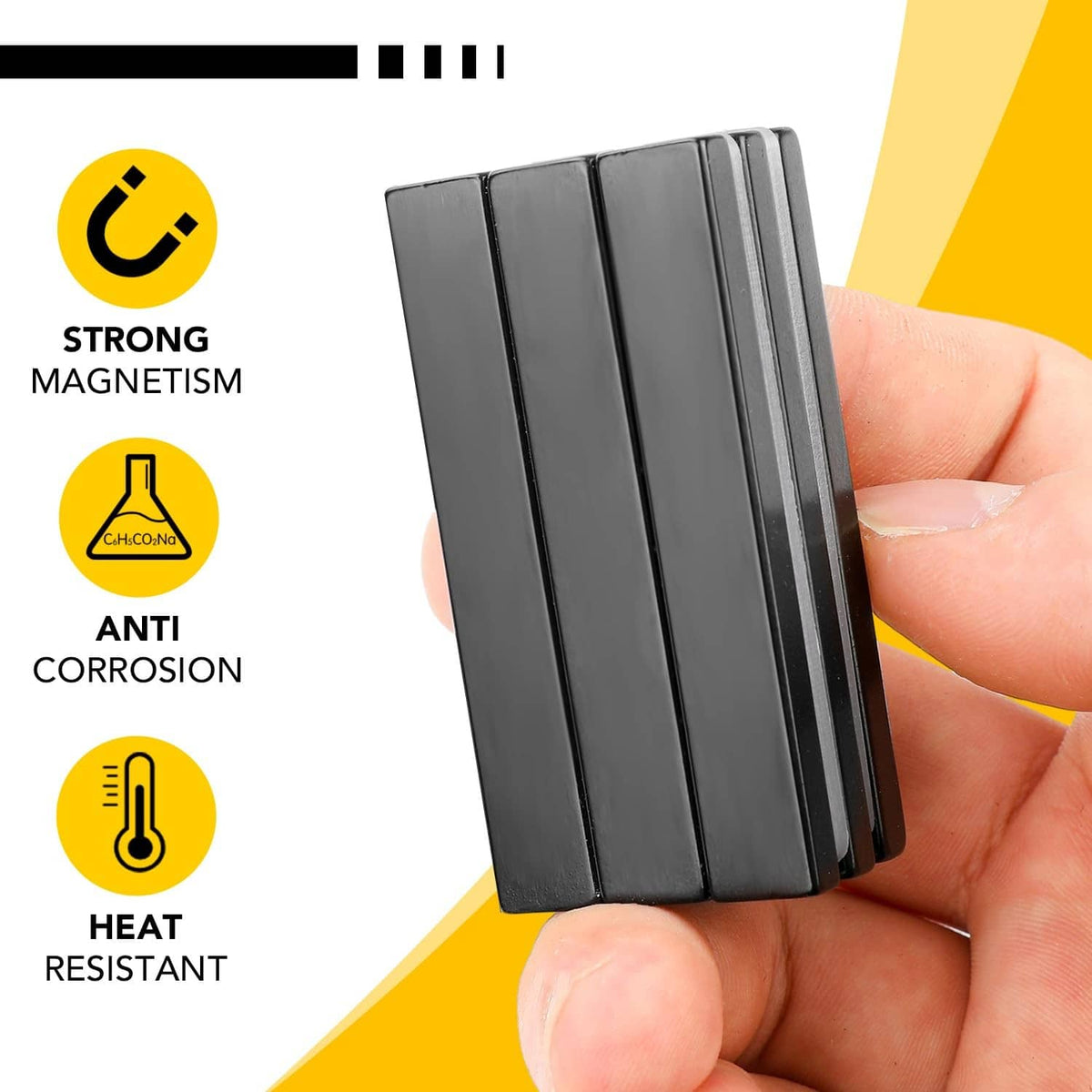 Black neodymium magnetic strip bars held in hand from a small stack