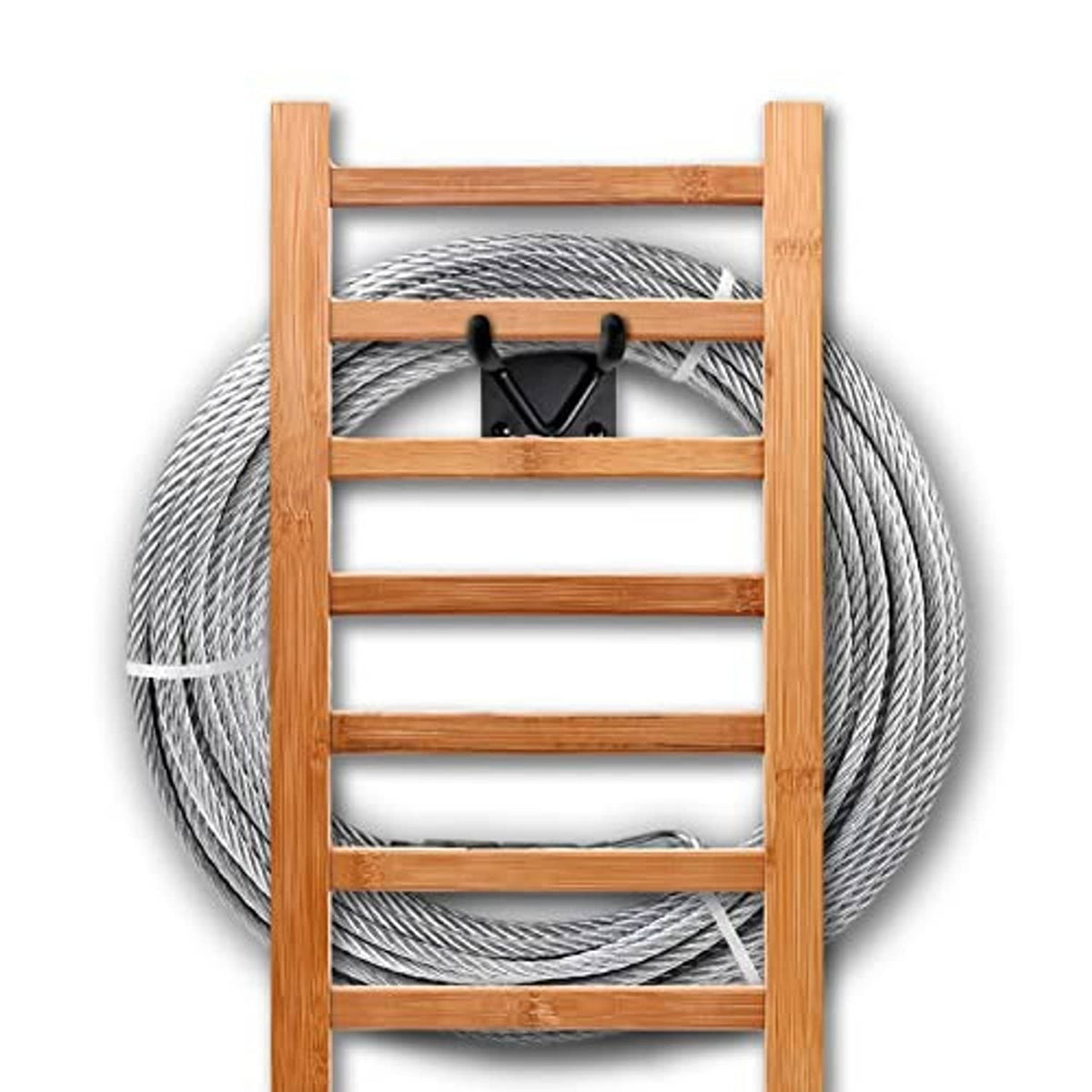 Black shovel wall hooks holding tools on a wooden rack with coiled wire behind