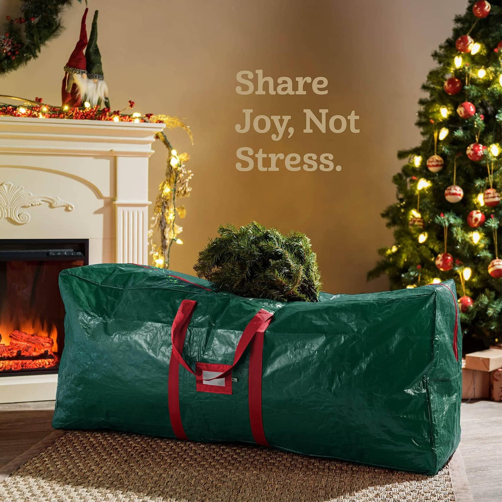 Green Christmas tree storage bag with red handles, laid horizontally for easy packing