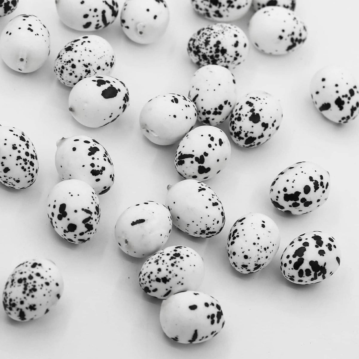 Artificial quail eggs cluster, white shells with black speckled pattern