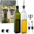 Set of two glass olive oil dispensers with flip-cap spouts, clear and green bottles