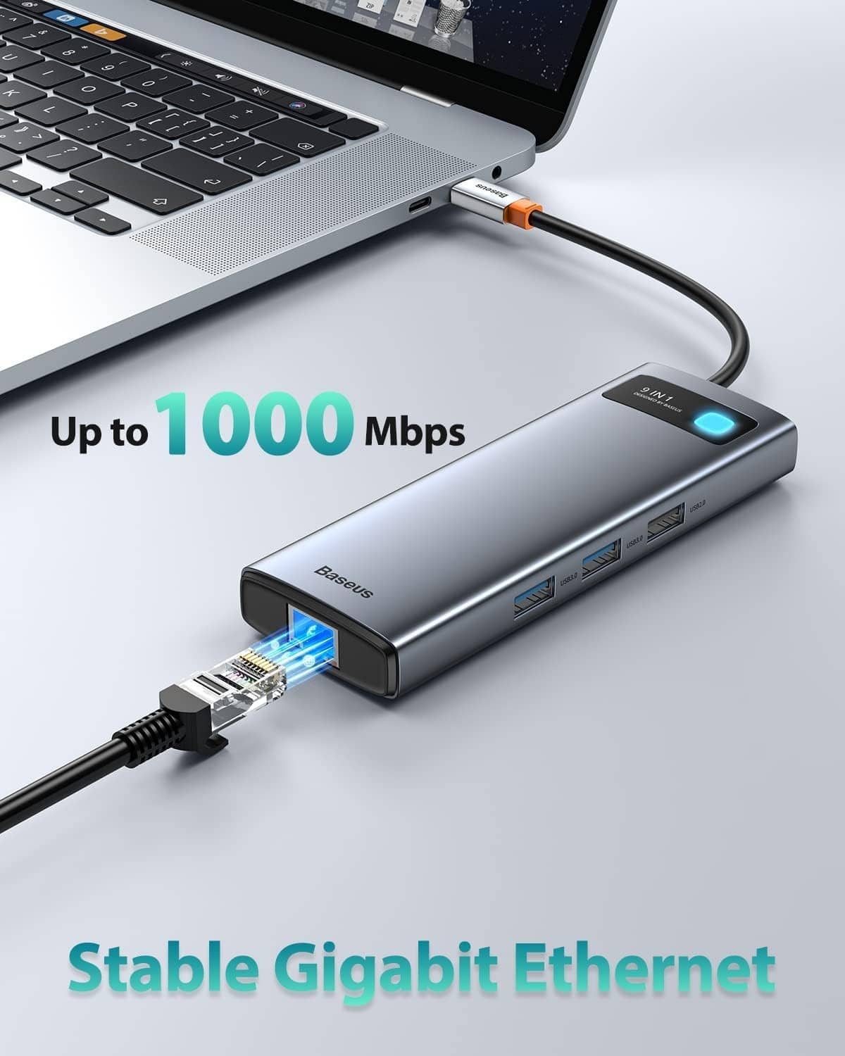 Grey USB-C hub with blue indicator and Ethernet port connected to a laptop