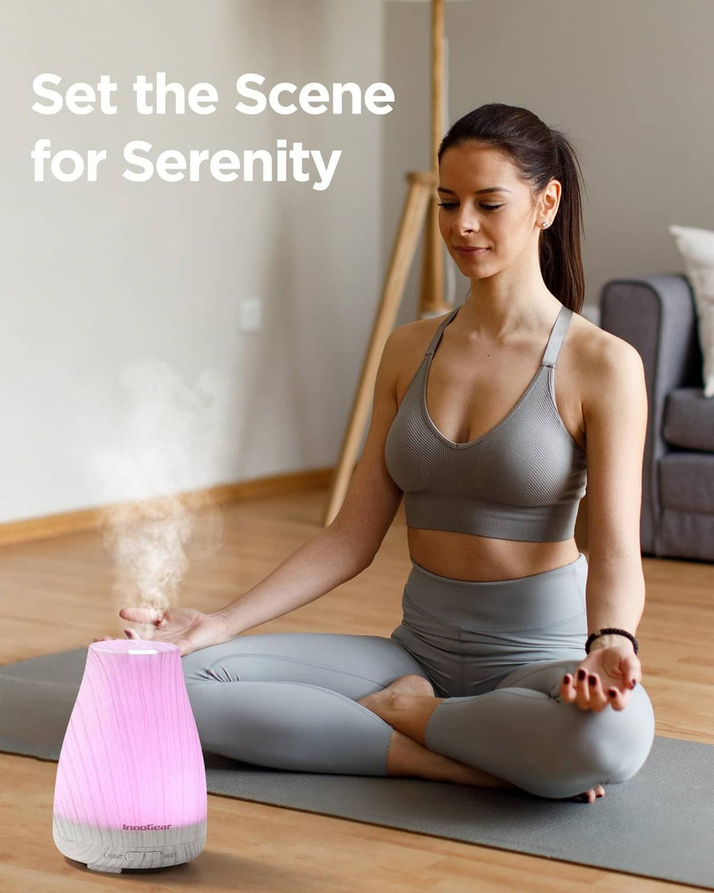 InnoGear essential oil diffuser with pink LED glow, white-gray textured housing