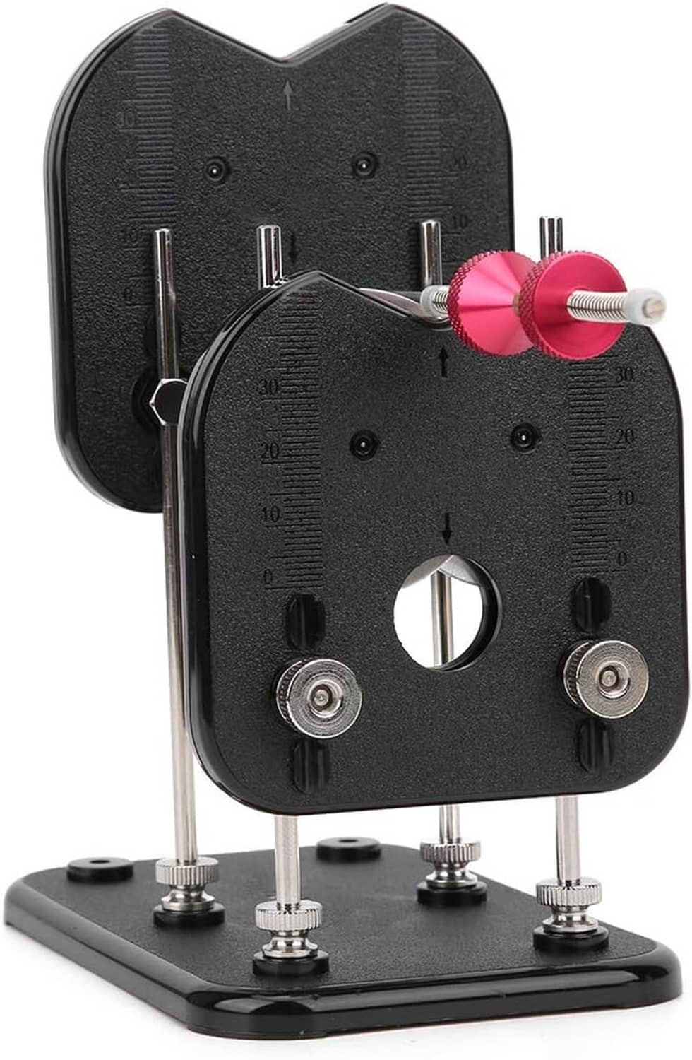 RC prop balancer stand close-up of black prop holders, pink hub, and metal posts