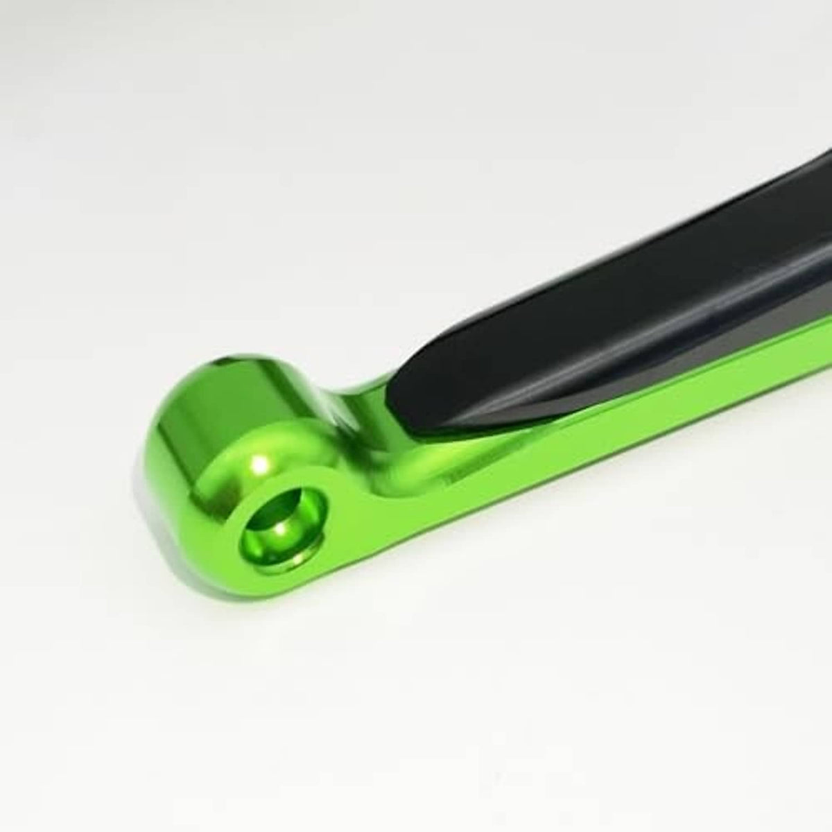 Green motorcycle folding extendable lever with black end cap and rounded mounting tip