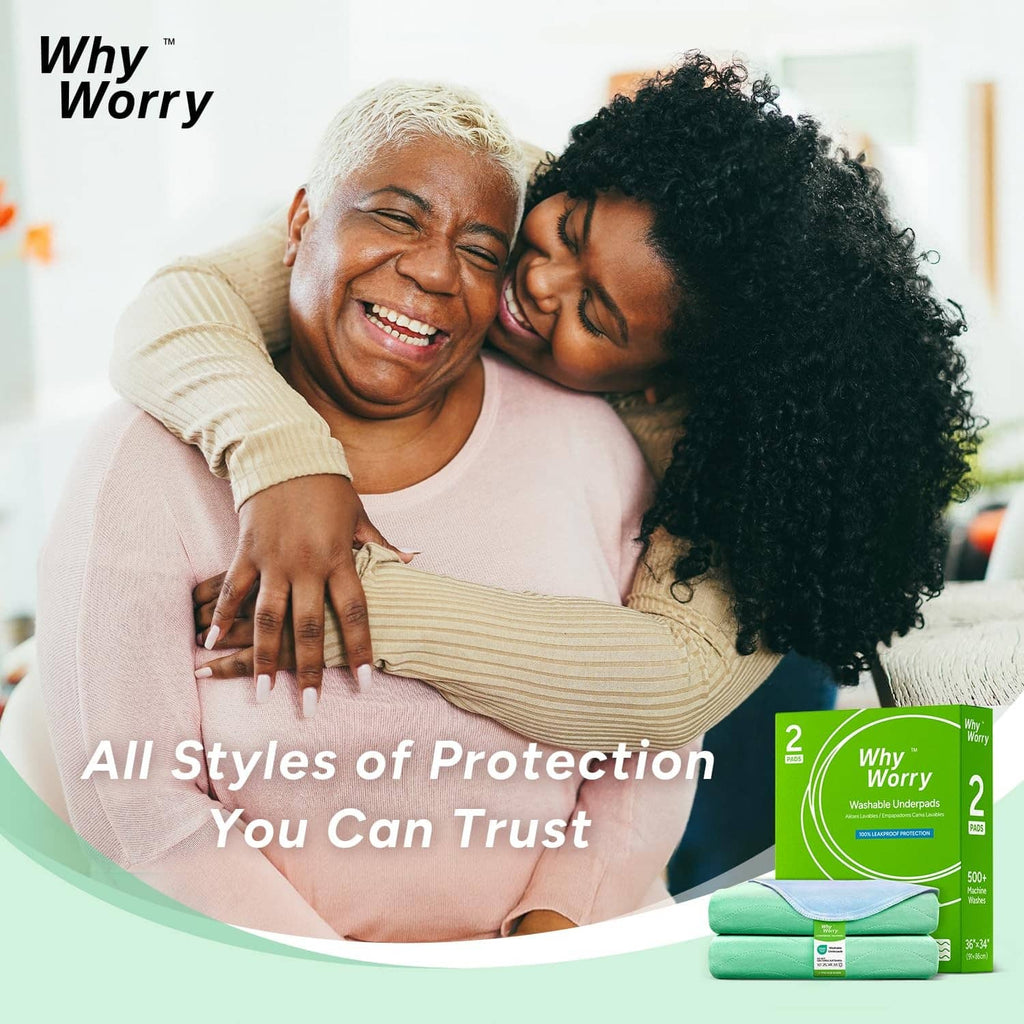 Green washable bed pad pack beside an adult couple relaxing on a bed