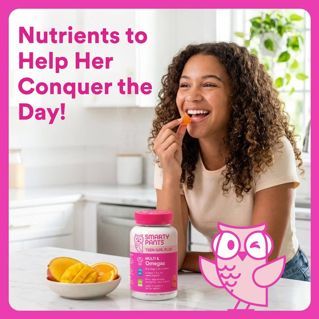 Teen girl eating an orange gummy with a pink multivitamin bottle on a counter.