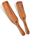 Two natural wooden spurtle spatulas with carved end and small hole in handle