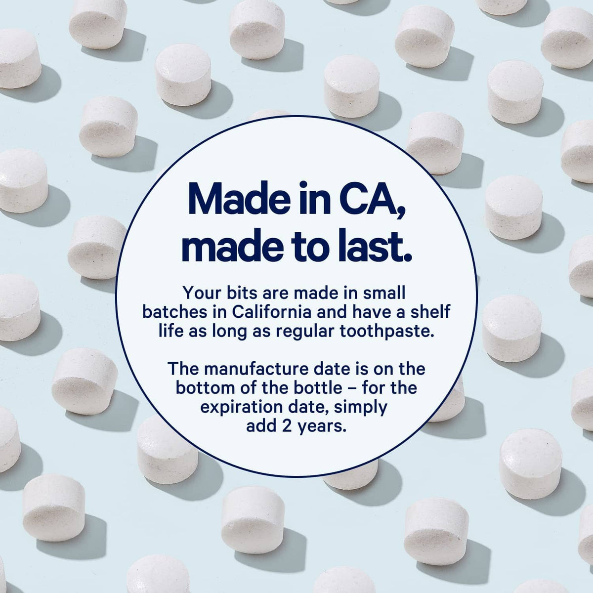 White Bite toothpaste tablets scattered around a made-in badge statement card