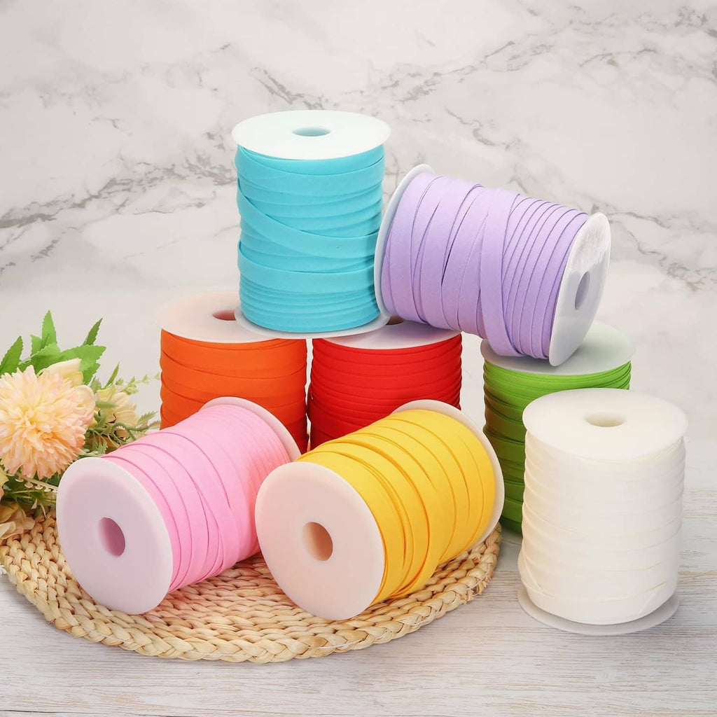Multiple double-fold bias tape spools, including a wine red roll