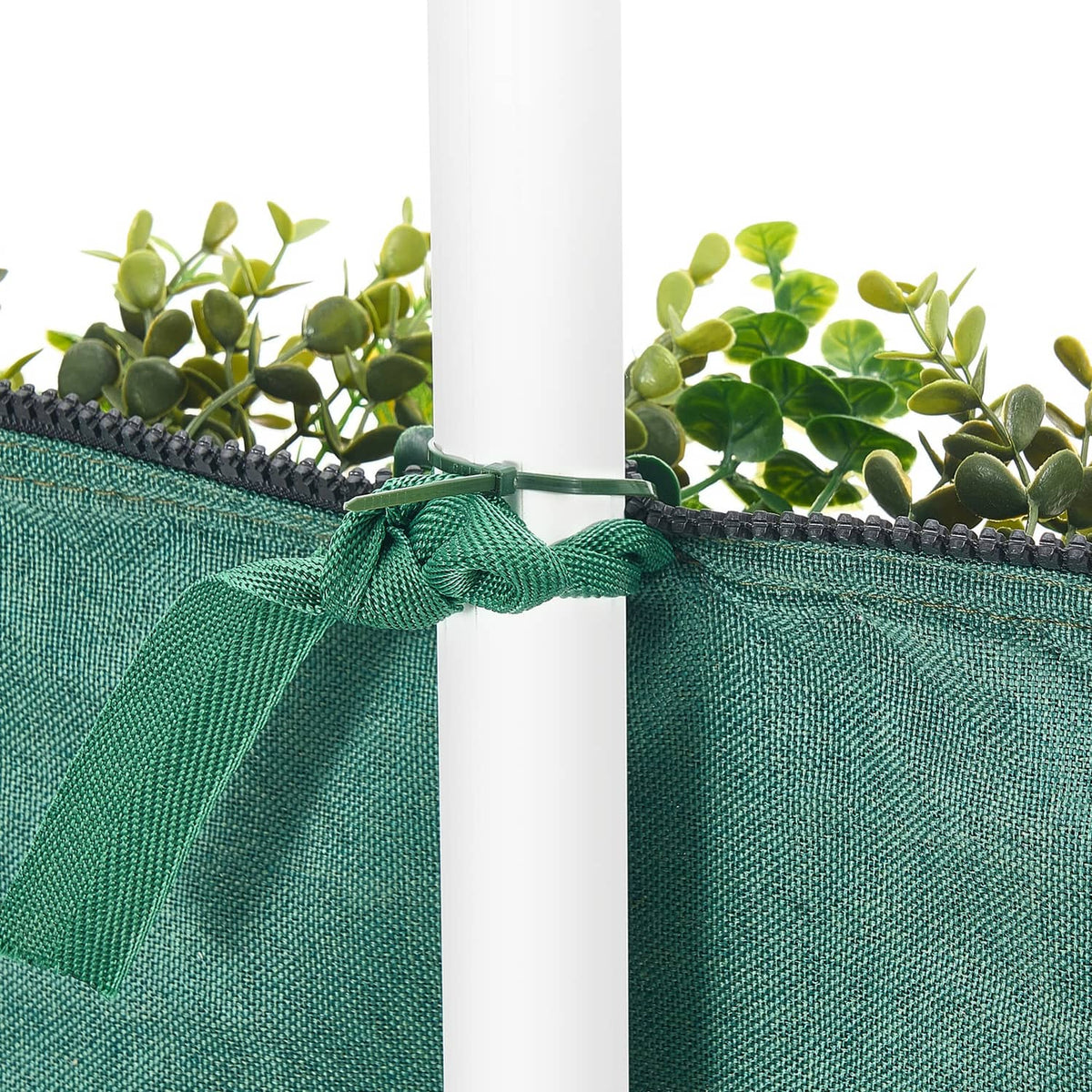 Artificial floral wall backdrop panel top edge with green fabric mesh and ribbon tie