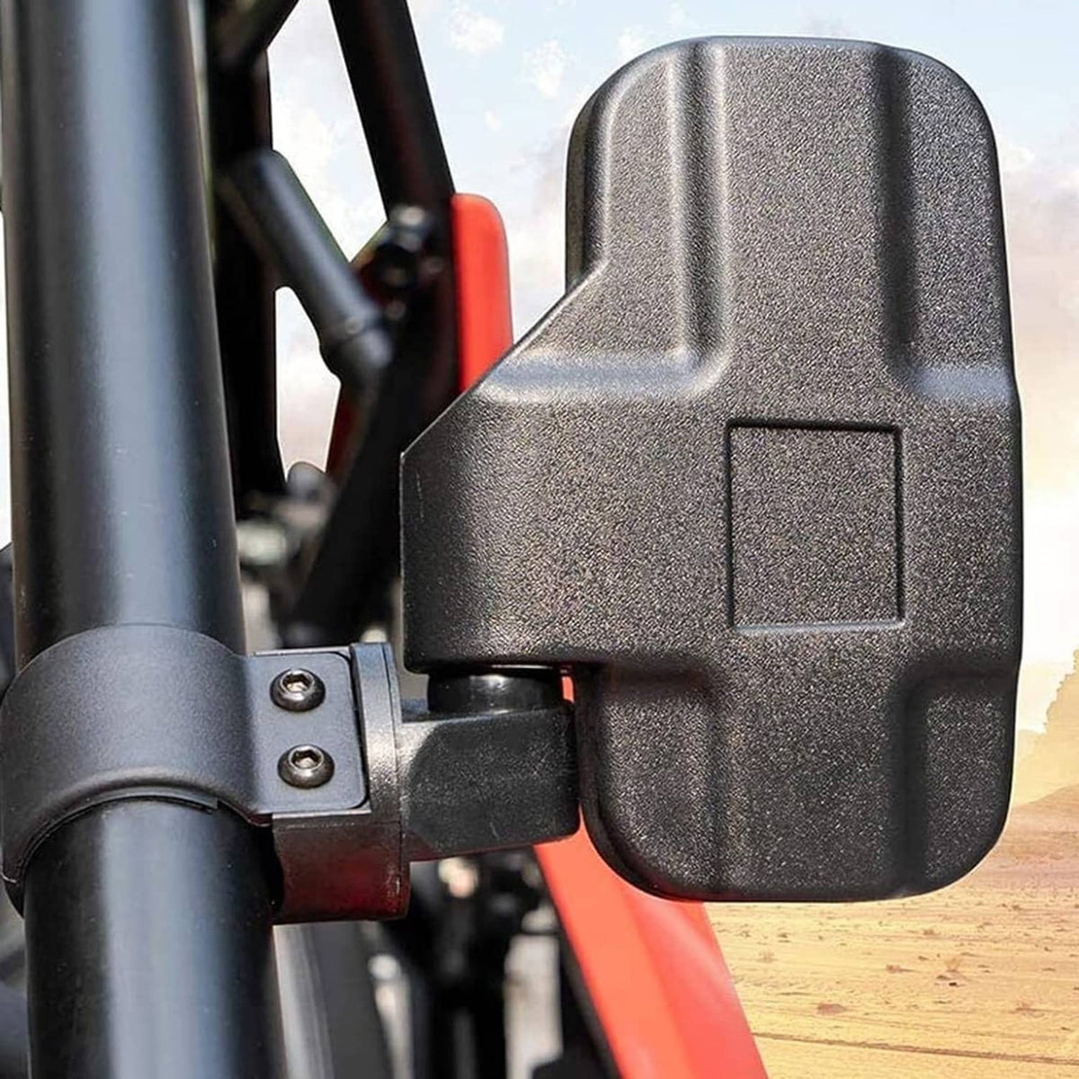 Close-up of black UTV mirror housing and mounting hardware on a roll bar