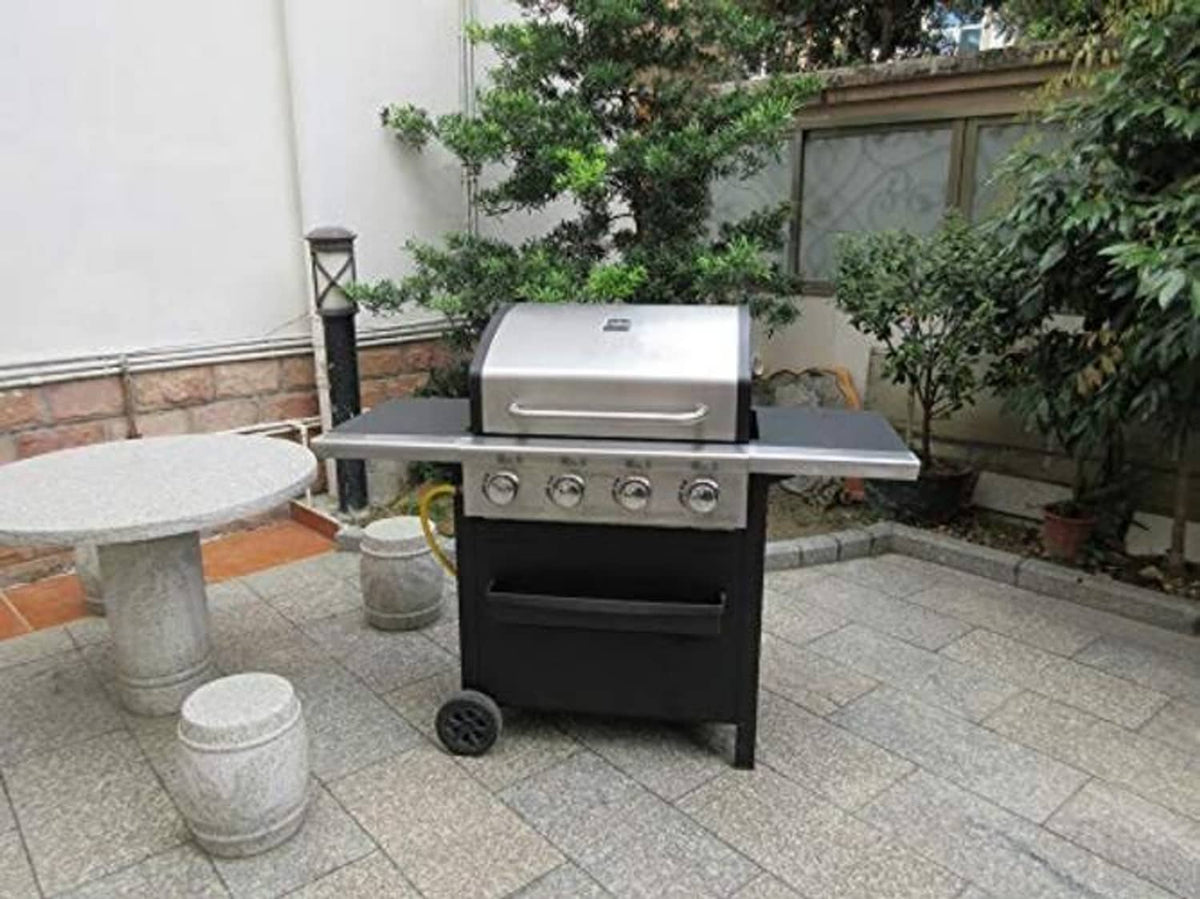 Stainless steel gas grill with control panel on patio