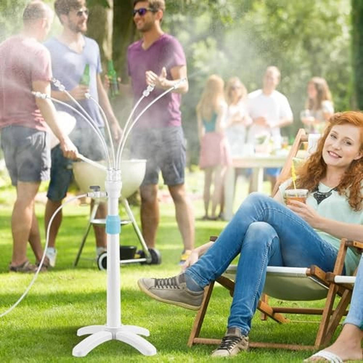 Outdoor patio misting stand with white base, central pole, and multiple spray nozzles