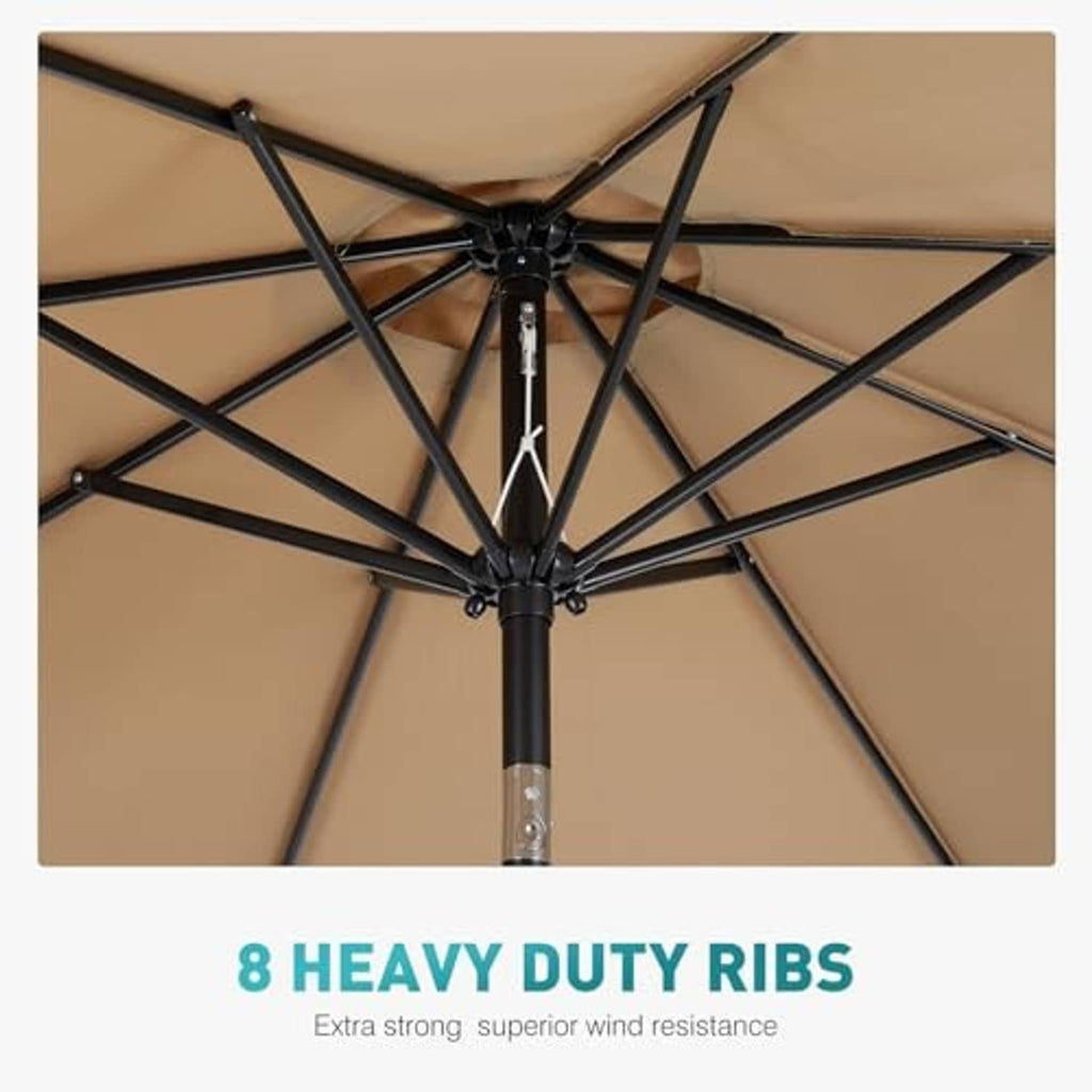 Tan umbrella canopy underside showing heavy-duty ribs and black pole mechanism at center