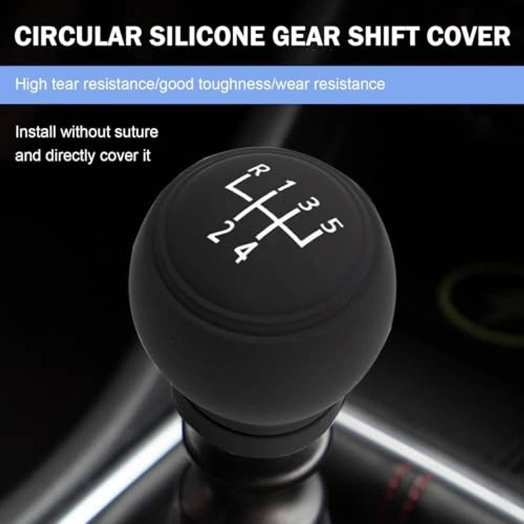 Round black gear shift knob cover with 5-speed shift grid, installed on manual shifter