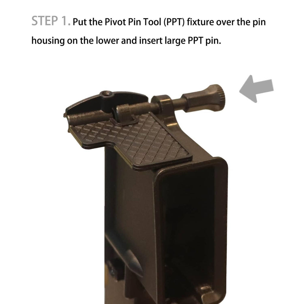 Pivot pin install tool held over a pin housing; black base with brass-toned rod.